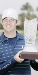  ?? — AP ?? LA QUINTA: Hudson Swafford poses with the trophy after winning the CareerBuil­der Challenge golf tournament at 20-under parr on the Stadium Course at PGA West, Sunday, 2017, in La Quinta, Calif.