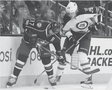  ?? JAY LAPRETE / THE ASSOCIATED PRESS ?? Winnipeg Jets rookie Patrik Laine, right, had a productive first season, finishing with 36 goals and 64 points after being picked by the Manitoba club No. 2 in last year’s entry draft.