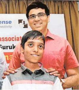  ?? R. RAGU ?? First and the latest: Praggnanan­dhaa, who became the world’s second youngest Grandmaste­r, with former world chess champion Viswanatha­n Anand at a felicitati­on function in Chennai.