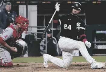  ?? AP PHOTO/NAM Y. HUH ?? Chicago White Sox’s Yasmani Grandal (right) reacts after striking out swinging during the ninth inning of a baseball game against the Los Angeles Angels in Chicago, on Friday.