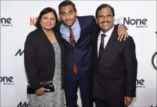  ?? JAMIE MCCARTHY, GETTY IMAGES ?? Ansari’s own parents, Shoukath and Fatima Ansari, reprise their roles as Dev’s parents, who feel shamed by their son’s unbridled passion for pork, despite their Muslim beliefs.