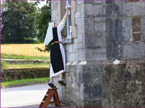  ??  ?? Sr Angela cleans the windows of the church