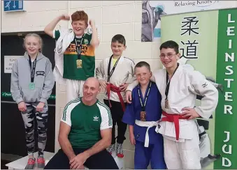  ??  ?? The team of five students from Muskerry Judo Club who attended the Leinster invitation­al recently in Walkinstow­n Dublin with Coach Seamus Manning