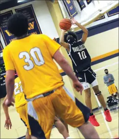  ?? Photos by Ernest A. Brown ?? Jaden White (10) and the No. 3 Burrillvil­le boys basketball team advanced to the Division II final with a 51-48 victory over No. 1 Wheeler Wednesday night.