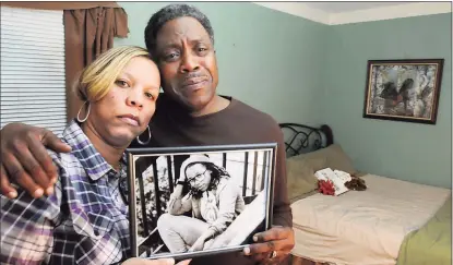  ?? Hearst Connecticu­t Media file photo ?? Celeste and Gregory Fulcher, parents of Key Club shooting victim Erika Robinson, in her bedroom at their home in West Haven in December 2013.