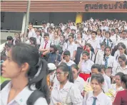  ?? WICHAN CHAROENKIA­TPAKUL ?? High school students leave an exam room after a test that will govern their chances of being admitted to Thammasat University. A new entrance exam, called ‘Entrance 4.0’ will be launched in 2018.