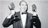  ?? AP 1963 ?? Carl Reiner holds two Emmys presented to him as best comedy writer for “The Dick Van Dyke Show.”