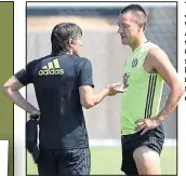  ??  ?? TRUE BLUE: John Terry, with boss Antonio Conte, will leave Chelsea this summer but has an offer to return in a non-playing capacity