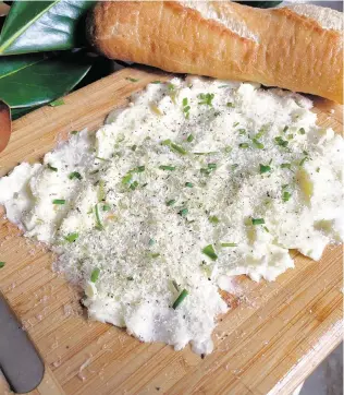  ?? JOY SUMMERS Minneapoli­s Star Tribune/TNS ?? Grate Parmesan cheese over butter with a little cracked black pepper, onion salt and chives for this savory spread.