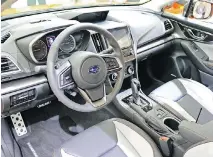  ??  ?? The interior of the 2018 Subaru Crosstrek features excellent material, such as the two-tone grey leather upholstery in the Limited model.