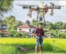  ?? — Xinhua ?? a young farmer operating a DJI agricultur­al drone in Thailand. Malaysia is hoping to train more young people here for the smart agricultur­e and agrofood sectors.