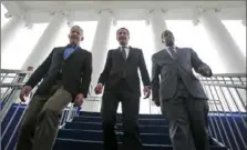  ?? Steve Helber/Associated Press ?? Virginia Gov.-elect, Lt. Gov Ralph Northam, center, walks down the reviewing stand with Lt. Gov-elect, Justin Fairfax, right, and Attorney General Mark Herring, as they prepare Jan. 12 for their inaugurati­on in Richmond, Va.