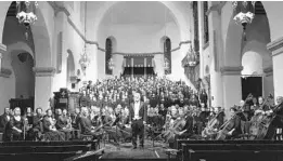  ?? COURTESY OF DOUGLAS W. JACKSON ?? Music director John Sinclair, center, leads the choir and orchestra of the Bach Festival Society of Winter Park. The society held its first concert of the season this weekend.