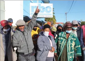  ?? Photo: Steven Klukowski ?? Pay us today… //Kharas residents who demonstrat­ed their unhappines­s over their delayed social grant payments yesterday in Keetmansho­op.