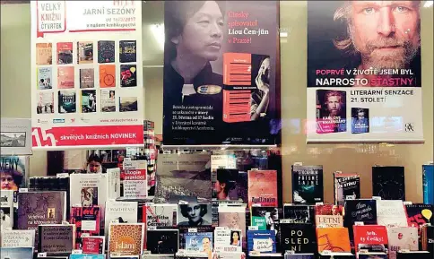  ?? PHOTOS PROVIDED TO CHINA DAILY ?? Chinese writer Liu Zhenyun’s poster draws attention in a European bookstore. Liu is the “reading ambassador” of the upcoming 25th Beijing Internatio­nal Book Fair. The annual event aims to enhance internatio­nal cultural exchanges and Chinese books’ global appeal.