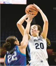  ?? JESSICA HILL/AP ?? Villanova’s Maddy Siegrist (20) shoots over Depaul’s Anaya Peoples (22) during the second half of Saturday’s Big East Conference tournament quarterfin­al at Mohegan Sun Arena in Uncasville.