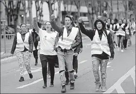  ?? AP/CLAUDE PARIS ?? French protesters gather in Marseille on Saturday for a demonstrat­ion stemming from the government’s decision to raise fuel taxes.