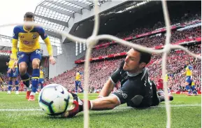  ?? PHOTO: GETTY IMAGES ?? Oops . . . Wesley Hoedt, of Southampto­n, scores an own goal past goalkeeper Alex McCarthy for Liverpool’s first goal in its 30 English Premier League victory at Anfield in Liverpool yesterday.