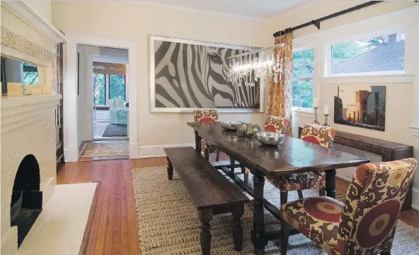  ?? STEPHEN YOUNG/LAURA CASEY INTERIORS ?? The colour and texture of other items in the dining room complement a large photograph of a zebra to establish a sense of exoticism at home.