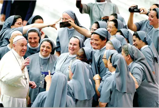  ?? (REUTERS/ Yara Nardi) ?? PAPAL GROUFIE – Pope Francis greets a group of nuns during the weekly general audience at the Vatican , August 7, 2019. Their smiles tell of the conviviali­ty and blessednes­s of the meet as some of the sisters rush to take a photo of their moment with the pontiff.