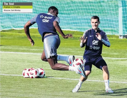  ?? PHOTO: REUTERS ?? French flair . . . France midfielder Paul Pogba (left) and forward Antoine Griezmann fool around during a training session in Moscow yesterday.