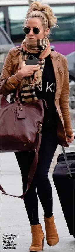  ??  ?? Departing: Caroline Flack at Heathrow yesterday