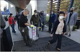  ?? JEFF GRITCHEN — THE ORANGE COUNTY REGISTER ?? Doses of the Pfizer BioNTech COVID-19 vaccine arrive at Providence St. Joseph Hospital in Orange on Wednesday.