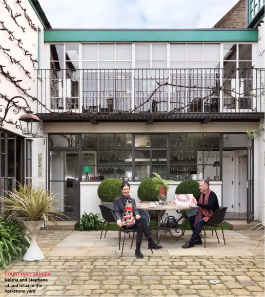  ??  ?? COURTYARD GARDENNeis­ha and Stephane sit and relax in the Yorkstone yard