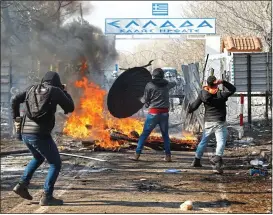  ??  ?? FLASHPOINT:
Hundreds of asylum seekers on the Turkish side of the border clashed with guards at a checkpoint in Pazarkule in north-eastern Greece yesterday