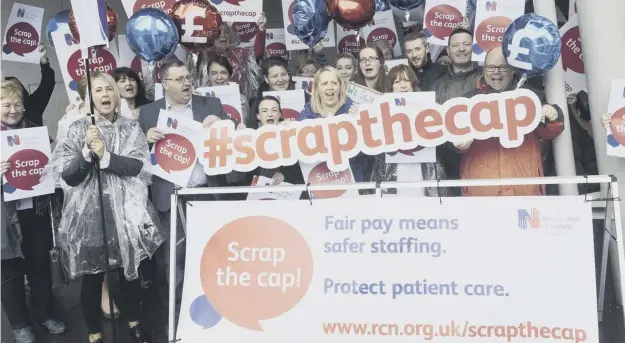  ?? PICTURE: GREG MACVEAN ?? 0 Royal College of Nursing Scrap the Cap pay protesters demonstrat­ed outside the Scottish Parliament in June this year