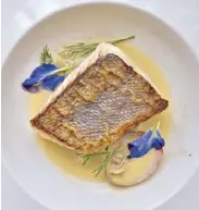  ??  ?? Emperor fish with fennel and truffles and clam juice Australian Wagyu striploin with watercress and cauliflowe­r