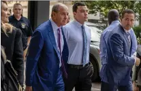  ?? TOM GRALISH — THE PHILADELPH­IA INQUIRER VIA AP ?? Philadelph­ia police Officer Mark Dial at the Juanita Kidd Stout Center for Criminal Justice in Philadelph­ia on Sept. 19 with attorneys Brian McMonagle, left, and Fortunato Perri.