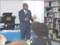  ?? STAFF PHOTO BY JAMIE ANFENSON-COMEAU ?? Immigratio­n attorney Isaac Falusi speaks at a “Know Your Rights” forum hosted by the Women of Action Charles County on March 25.