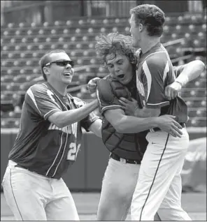  ?? NWA Democrat-Gazette/ANDY SHUPE ?? Harrison catcher Tel Parker (center) celebrates with teammates after the Goblins held off White Hall for a 2-1 victory Saturday in the Class 5A baseball state championsh­ip game at Baum Stadium in Fayettevil­le. More photos are available at...