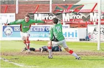  ?? [PHOTO PROVIDED] ?? Chris Morgan (left) celebrates his last-minute goal in Glentoran FC's win over rival Linfield on April 23, 2005.