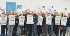  ??  ?? Staff celebrate as XL Displays is named one of the top 100 businesses.
