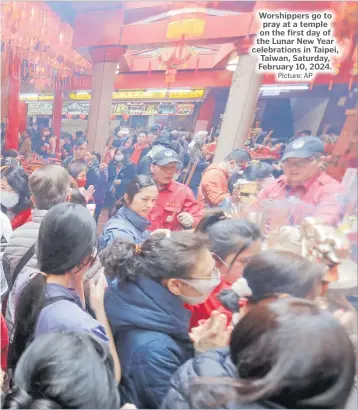 ?? Picture: AP ?? Worshipper­s go to pray at a temple on the first day of the Lunar New Year celebratio­ns in Taipei, Taiwan, Saturday, February 10, 2024.
