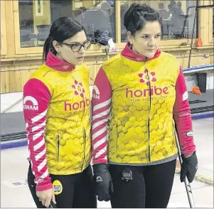  ?? CHARLES REID/THE GUARDIAN ?? Lead stone Michelle McQuaid, left, and skip Robyn MacPhee discuss a shot at a recent practice in Cornwall. Last year’s P.E.I. Scotties champion takes on four other rinks in defence of their provincial curling title beginning today at the Cornwall...