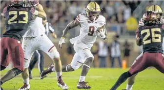 ?? ASSOCIATED PRESS ?? OPEN IT UP: BC receiver Kobay White finds a hole against Florida State.