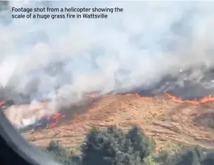  ??  ?? Footage shot from a helicopter showing the scale of a huge grass fire in Wattsville