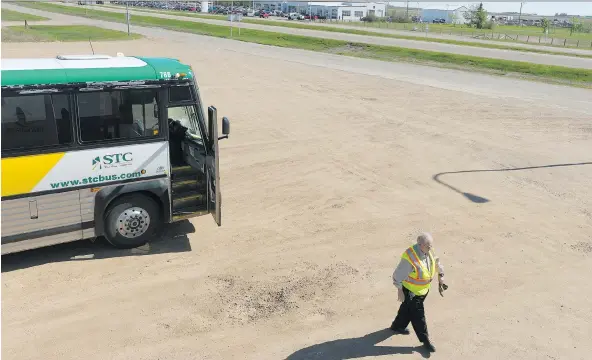  ?? PHOTOS: MICHAEL BELL ?? STC bus driver Walter Kacuiba stretches his legs after arriving in Melfort. He says he has received postcards from around the world from former passengers.