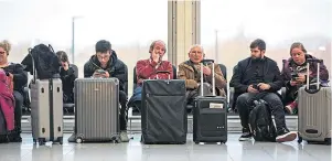  ??  ?? Passengers at Gatwick Airport after drone sightings grounded planes in December