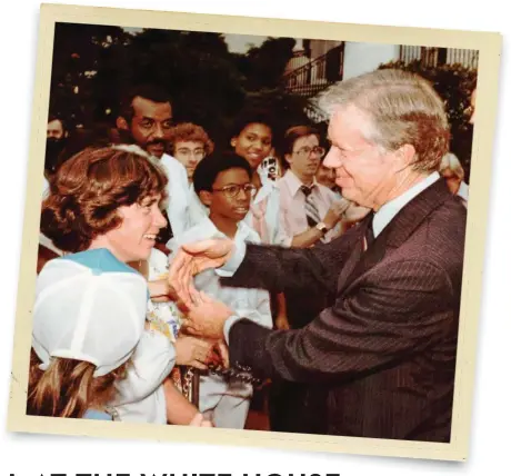  ??  ?? A WHITE HOUSE photograph­er took
this picture of 16-year-old Laurie
gazing up at President Carter.