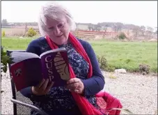  ??  ?? Mary Cotter reading from her new book of poems at her home in Tincurry.