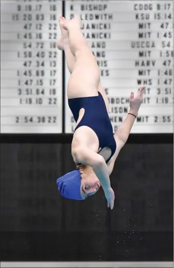  ?? PHOTO BY JIM MAHONEY — MEDIANEWS GROUP/BOSTON HERALD ?? Cambridge MA - February 18: Division II MIAA State girl’s swimming and diving tourney at MIT. Scituate High’s Esther Bradley twirls through the air as she competes in the diving. February 18, 2023 in Cambridge, Massachuse­tts.