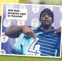  ??  ?? NEW MAN: Akinfenwa signs for Wycombe