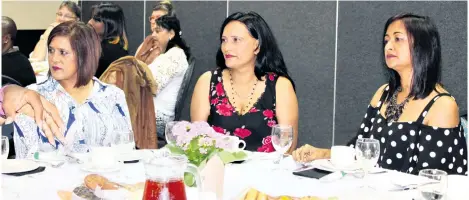  ?? Gugu Myeni ?? Guests Sharon Bissoondia­l, Sandra Naidoo and Irene Moonsamy listen to guest speaker Felicia Buthelezi