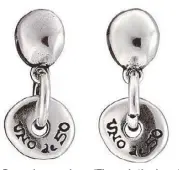  ??  ?? Pasando por el aro (Through the hoop) silver-plated articulate­d earrings with two irregular spheres joined together by two small rings.