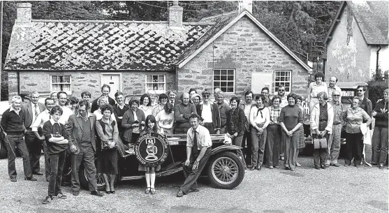  ??  ?? Members of the Strathmore Vintage Vehicle Club are pictured in 1980 with members of a Swiss Vintage Vehicle Club from Bern. The Strathmore Club members played host to the Swiss folk until the Glamis Extravagan­za was over. The photograph was taken at...