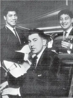  ?? AUCKLAND STAR HISTORIC COLLECTION ?? Waka Nathan, left, Pat Walsh – playing the piano – and Mac Herewini polishing up their musical skills at their hotel in London, during an All Black tour of England in 1963-64. Walsh was denied the opportunit­y to tour South Africa in 1960.